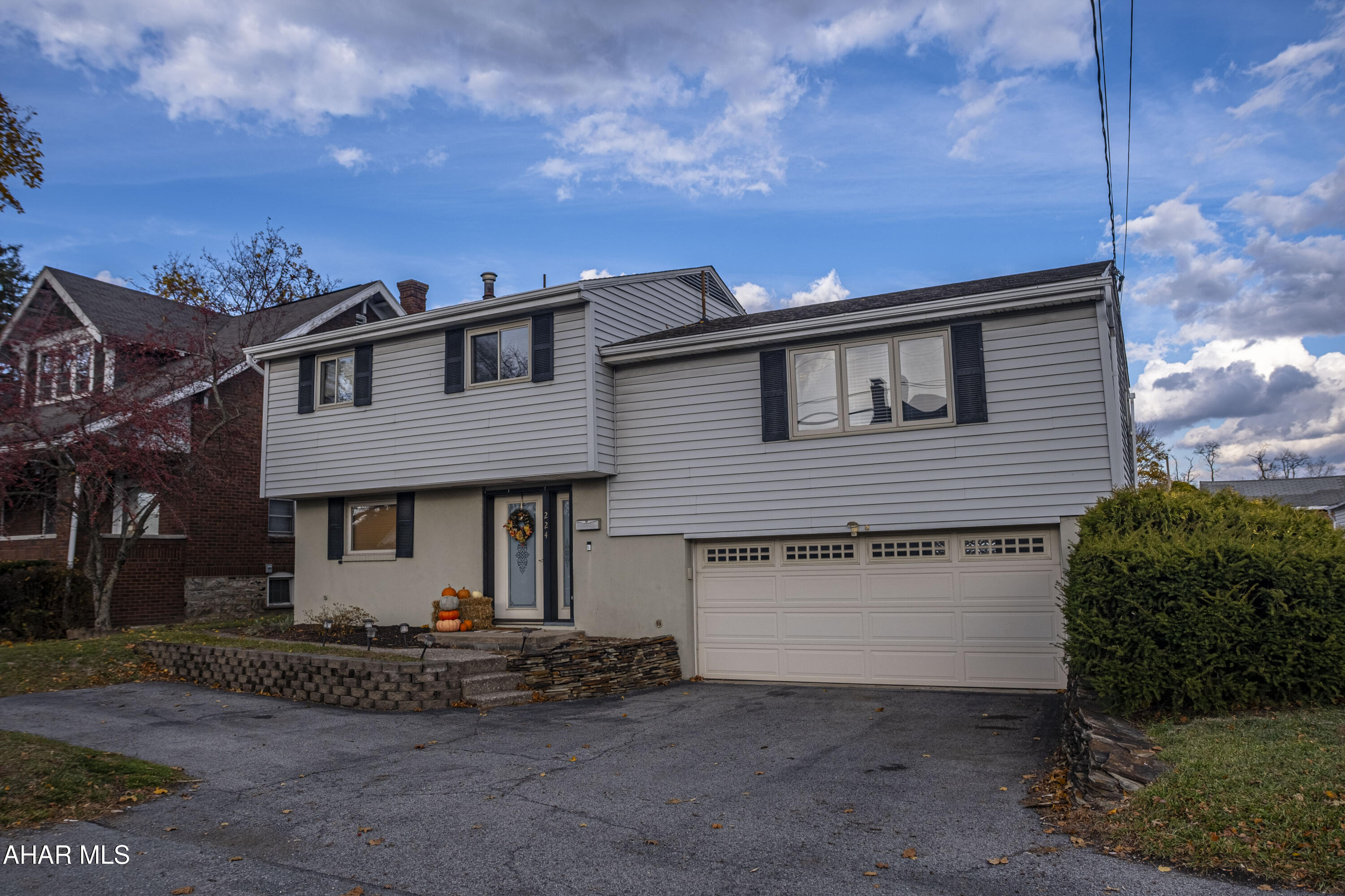 Welcome to this inviting raised-ranch, multi-level home in Altoona, offering a spacious layout and a convenient location close to restaurants, shops, and everyday amenities. The main level features a warm and welcoming flow with attractive wood-look flooring throughout the living room, dining room, and updated kitchen with included appliances. Three comfortable bedrooms and 1.5 baths provide practical living space, while the split-level design offers great separation and flexibility for daily life.
A highlight of the home is the screened-in back porch and sunroom, a relaxing space perfect for enjoying morning coffee, casual meals, or quiet downtime. The level, fenced yard adds even more usable outdoor space. Additional features include central air, natural gas hot water heat, a wide driveway, and a spacious 2-car garage with excellent parking and storage. This well-loved home is move-in ready and perfectly positioned for comfort and convenience in Altoona.