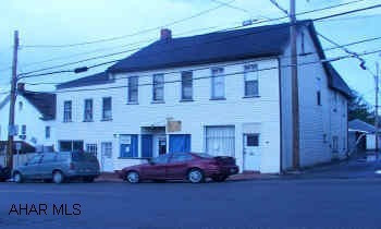 5 UNITS, COULD BE STORE FRONT.  FURNACE, ROOF, HOT WATER HEATER ALL ONE YEAR OLD. ELECTRIC 100 AMP (3 YRS.) TO CODE. 5 RANGES & REFRIGERATORS INCLUDED. 5 PARKING LOTS, TWO ARE EVENING ONLY. SELLER TO PROVIDE HOME WARRANTY AT FULL PRICE. OWNER PAYS ALL WATER & HEAT AND PAYS ELECTRIC ONLY FOR 1ST FLOOR.