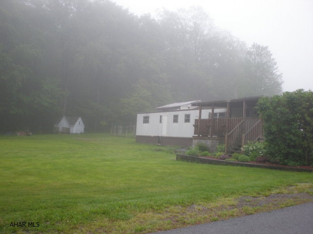 Beautiful building site. Currently has mobile home on - can be included or removed (poor condition). Shed on property. Nice homes on this street.