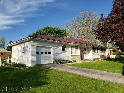 3-bedroom home with hardwood floors, new metal roof (2020), 2 fireplaces, level lot, attached 1-car garage, enclosed back porch & fenced back yard on .22 acre lot in beautiful neighborhood & 1 block to Morrison Cove Memorial Park! J-586.  Seller just had exterior of home painted.