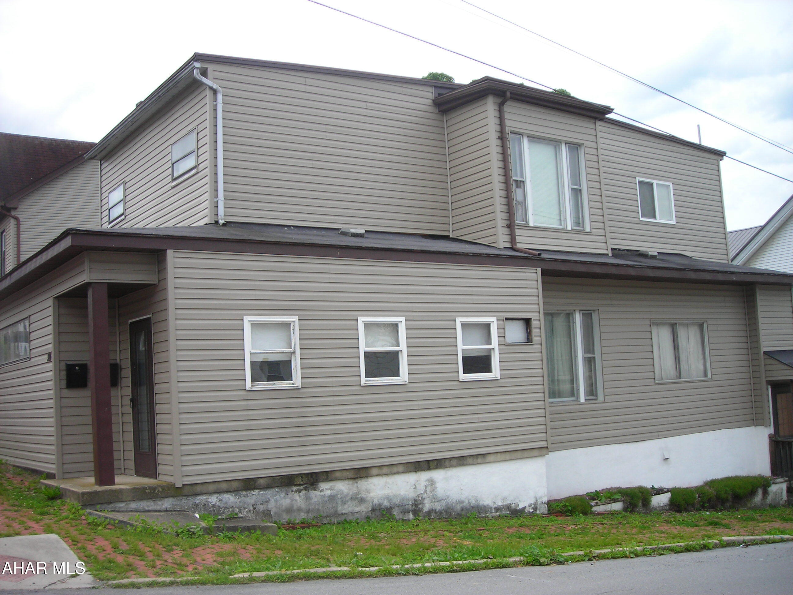 Nice 2-unit investment. Presently vacant. There is a one car garage. Please do not walk on garage roof needs repaired. Could be turned back into single home. Being sold as is, where is. Seller will make no repairs.