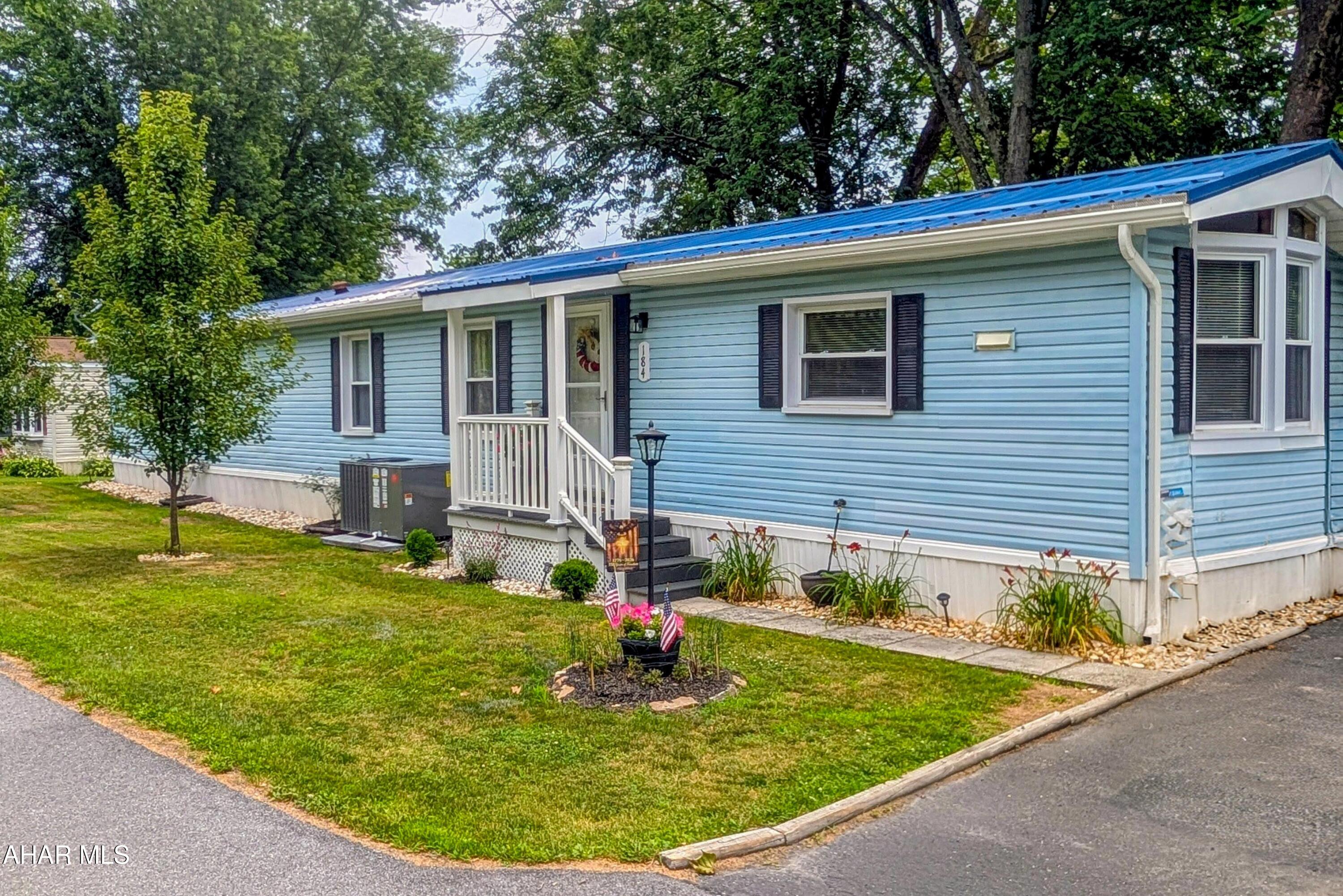 Welcome home to the highly sought-after Friendship Village, a vibrant 55+ community offering the perfect blend of comfort, convenience, and an active lifestyle. This beautifully remodeled 1987 single-wide home is situated on a desirable corner lot just steps from the community fishing pond, providing peaceful views and a relaxing setting.

Nearly every room has been thoughtfully updated, making this home truly move-in ready. The remodeled kitchen features new countertops, flooring, and all-new appliances, while the primary bathroom has been completely renovated with new walls, flooring, and a new tub. New flooring extends throughout the home, with the exception of the primary bedroom, and updated windows provide improved energy efficiency and natural light.

Enjoy your morning coffee or evening sunsets from the enclosed rear porch or the outdoor deck overlooking the scenic surroundings. Entertain family and friends around the backyard firepit, perfect for making memories year-round.

Additional updates include a brand-new central air conditioning system with heat pump, a Sunsetter® retractable awning with remote control, new vinyl railings and posts on the rear deck, a new Trex® front porch with vinyl railing, and rain gutter guards for low-maintenance living.

If you're looking for a beautifully updated home in one of the area's most desirable 55+ communities, this is an opportunity you won't want to miss!