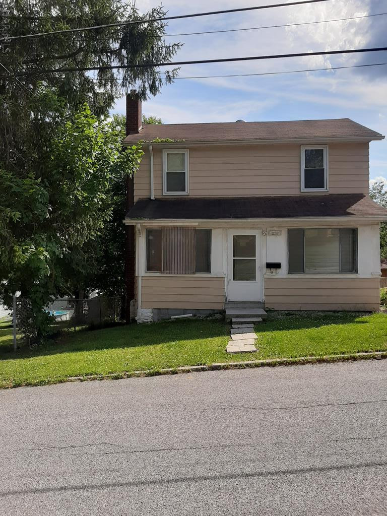 Nicely maintained 2 bedroom home in established neighborhood. Close to essentials. Well equipped kitchen with updated appliances. Nice sized living and dinging space with walk out to a cute backyard. Two very nice sized bedrooms upstairs with ample storage. Updated windows throughout,newer carpet, and updated bathroom. Just move right in! Also has a 1 car detached garage. Call today to see this move in ready home!!