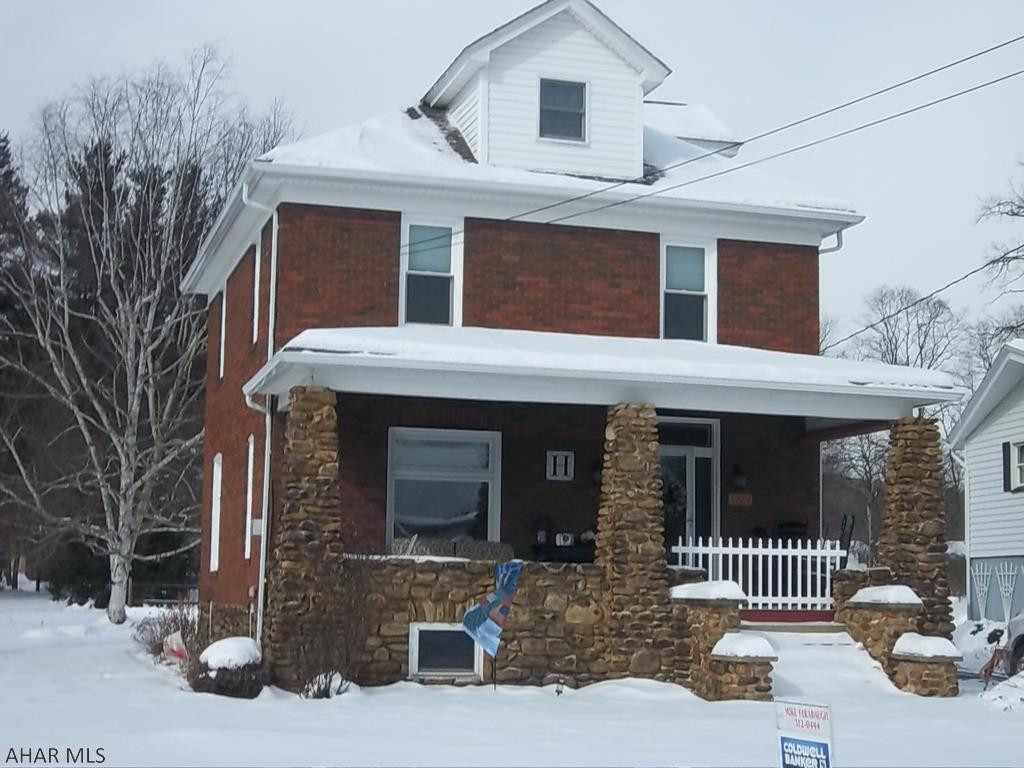 Classic brick 2.5 story home with a riverstone front porch in Eldorado.  Newer windows, hardwood floors throughout, main bath and kitchen have been fully updated with granite countertops.  Newer energy efficient  on demand boiler and hot water heater.  Don't miss this home, call today to schedule a showing of this awesome property.