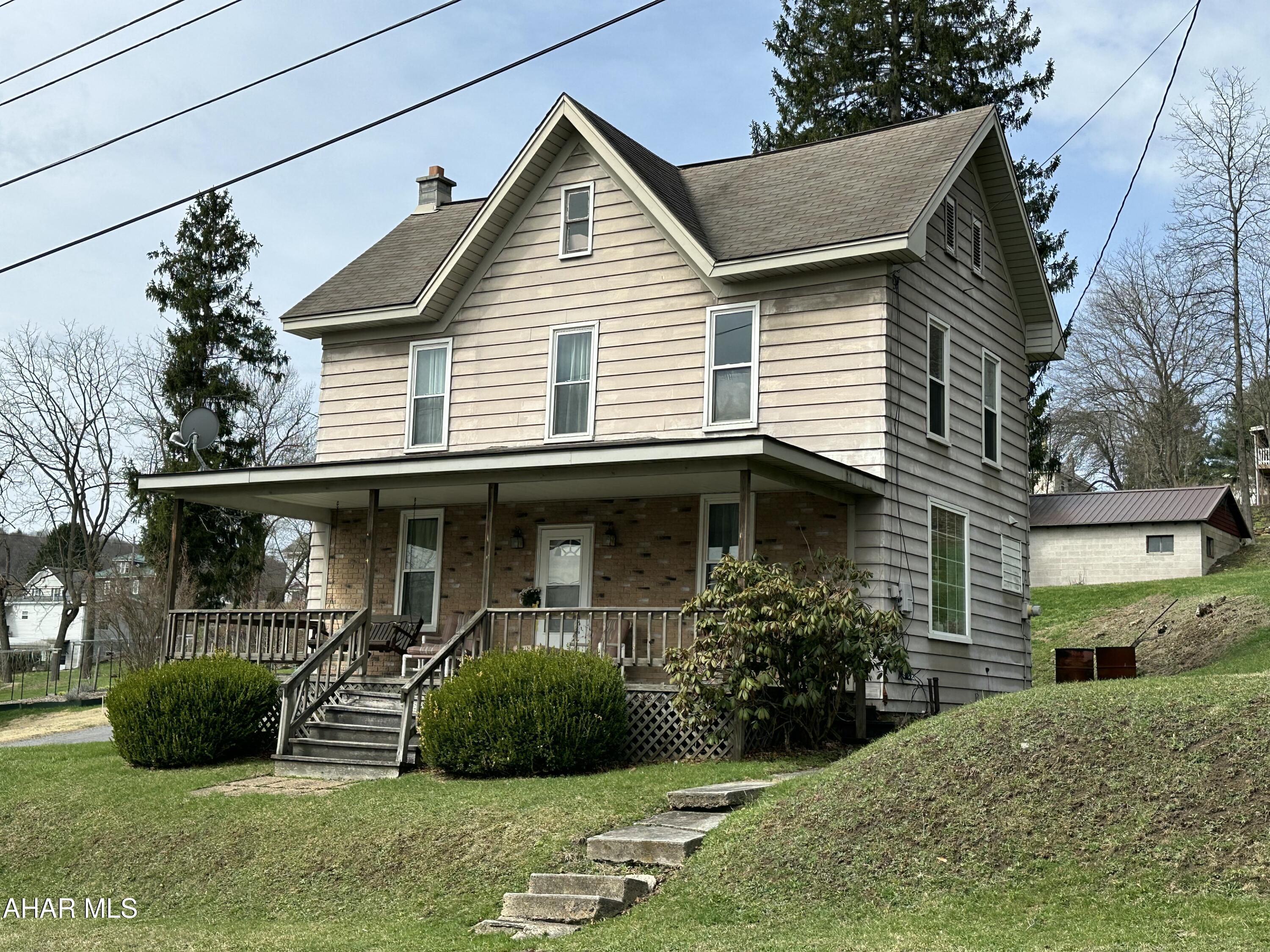 Nice two story home with new windows and large front porch for relaxing.  Very well kept with all furnishings staying.  Take a look for yourself.
