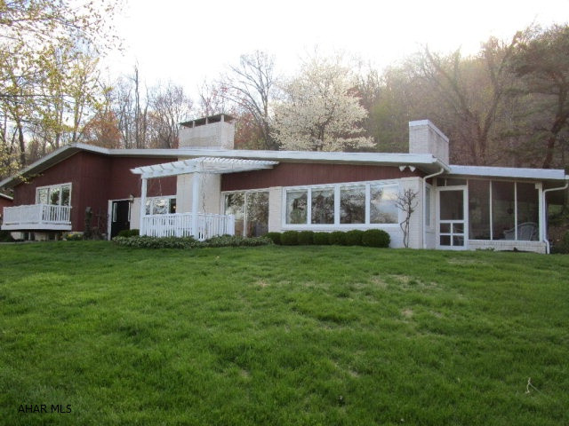 This custom built contemporary home rests on just over 61 acres. This well maintained home is just minutes from downtown Bedford but completely secluded and private. Expansive pastoral, mountain and skyline views and natural wildlife habitat with open and wooded land. The interior of the home features a recently updated custom kitchen with granite counters, dining area w/ picture window, LR w/ maple floors & stone hearth FP, 3-beds & 2-baths. Lrge Mstr BR has sliding door w/ deck for morning relaxtion & cer. tiled Mstr bath. Large windows throughout for natural light & outsoor views. Fin bsmt w/ large rec rm, 1/2 bath & laundry rm. Large screen porch, oversized 3-car gar, & storage building.  Don't miss this serene property!