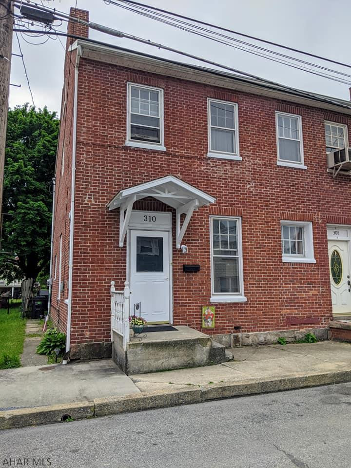 WHY RENT WHEN YOU CAN OWN!  This brick two story is located in beautiful Historic downtown Bedford.  This home has 3 bedrooms, a nice bath, spacious dining room and living room.  The back offers a covered porch and a spacious yard area for entertaining.  Conveniently located in downtown and walking distance to most everything you'll need.  The mortgage may be less than what you are paying in rent, or consider purchasing this as an investment  property.  Please note the other half of the duplex may also be purchased.