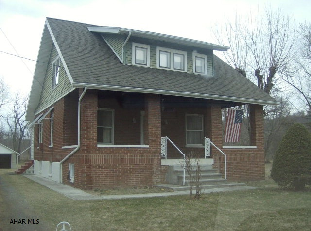 This brick and vinyl home is situated on a large flat lot, is functionally sound and along with some updating will provide years of comfortable living for the new owner. Previous owners utilized the bonus room on the main floor as a third bedroom. The stove and hot water heater are propane. As with all properties the exact boundaries of a property should be determined by a survey.  The property is conveniently located within minutes of I-99, Wal-Mart, Roaring Spring and Hollidaysburg.