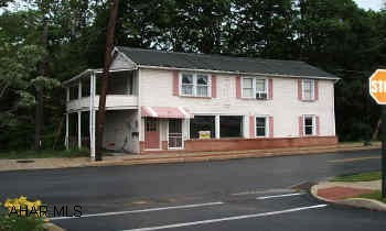Store front and apartment on second floor. New electric upgrade & new water line. Store front has new carpet and all walls repaired & repainted. Store front could easily be converted to apartment. Store front and apartment on second floor. New electric upgrade & new water line. Store front has new carpet and all walls repaired & repainted. Store front could easily be converted to apartment.