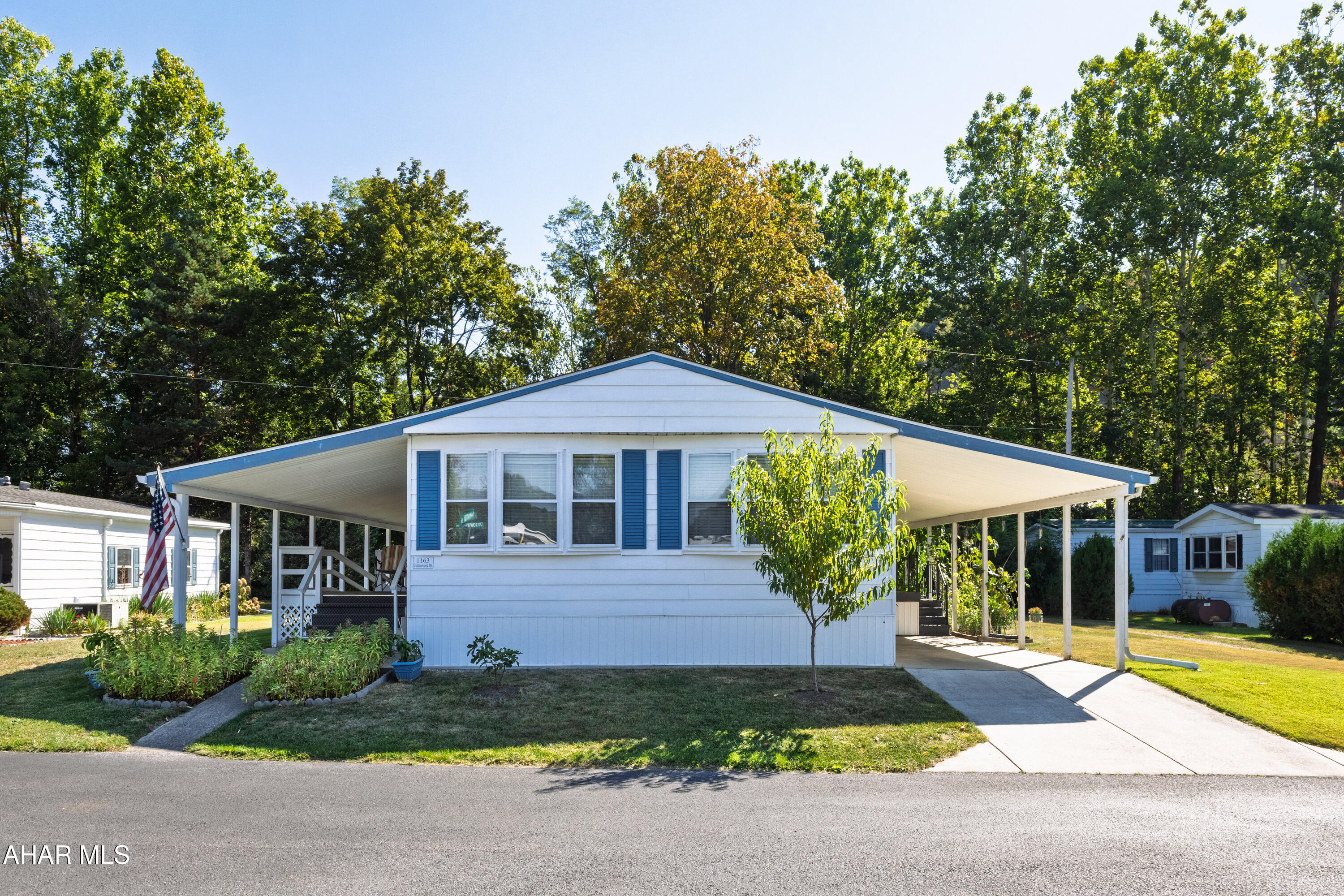 Spacious double-wide on a lot featuring a serene stream and 4 storage sheds in the backyard.
This well maintained double wide home offers 3 bedrooms, 2 full bathrooms, kitchen adjoining dining room and living room,  Enjoy night with 2 separate deck areas.  Lot also allows for gardening and recreation or simply relaxing by the stream.  This is a 55+ Community  Water and sewer is meter for each home and added to your monthly bill.
See list for many improvements during the ownership of the seller.

Don't miss outs on this one, great area and features.