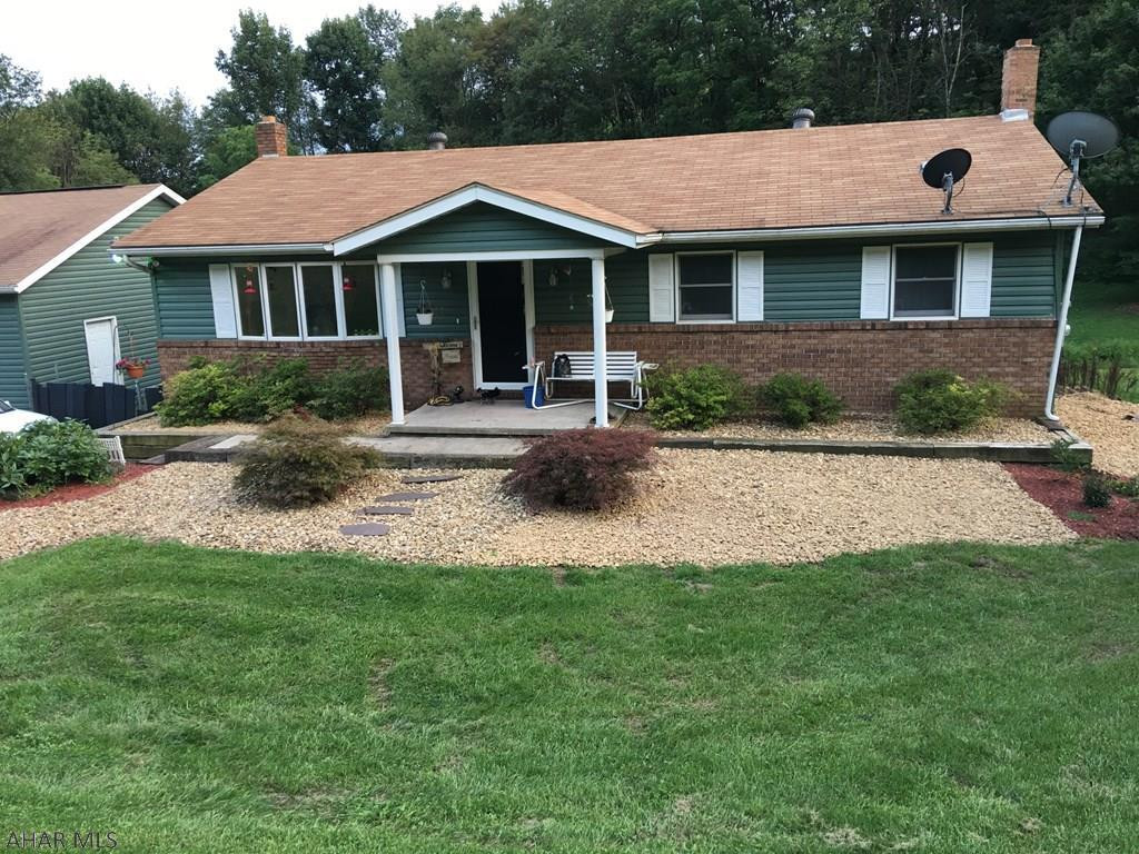 Nicely kept 3 bedroom ranch on just over one acre. Newly remodeled kitchen and living room. Back deck overlooking property. Detached 3 bay heated garage with a walkway to the house. Outdoor wood burner heats garage, house and water (in winter) natural spring feeds 1000 gallon holding tank/well. Beautiful county setting. Basement is walk-out partially finished. Could easily be converted into a rec room.