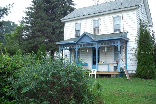 Nice large lot. Small summer cottage on property. 2 Car detached garage. Needs some TLC. Seller to put in new sand mound system for new buyers. All permits and bids are completed..Bring offers.