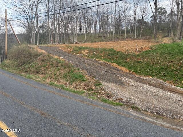 Discover the perfect slice of nature with this 1.88-acre vacant lot, offering endless possibilities for your dream retreat or future home site. This property provides
privacy, tranquility, and a connection to the outdoors.  Located just minutes from 961-acre Canoe Creek State Park centered around a 155-acre lake and directly across from excellent fishing in Canoe Creek, this lot is a haven for outdoor enthusiasts. Whether you enjoy casting a line, setting up camp under the stars, or simply unwinding in nature, this property delivers.  With no utilities currently in place, you have the flexibility to design and develop the land to suit your vision--whether it's a residential build, a seasonal getaway, or a rustic camping spot. The surrounding area is rich with opportunities for hiking, biking, and exploring, making it a prime location for anyone who loves an active, outdoor lifestyle.  This is your chance to own a piece of the outdoors.  Lot is still approximately 50% wooded.
