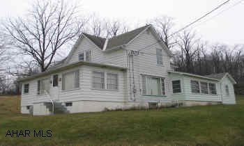 Two-story country home with acerage and barn. Home Warranty included.