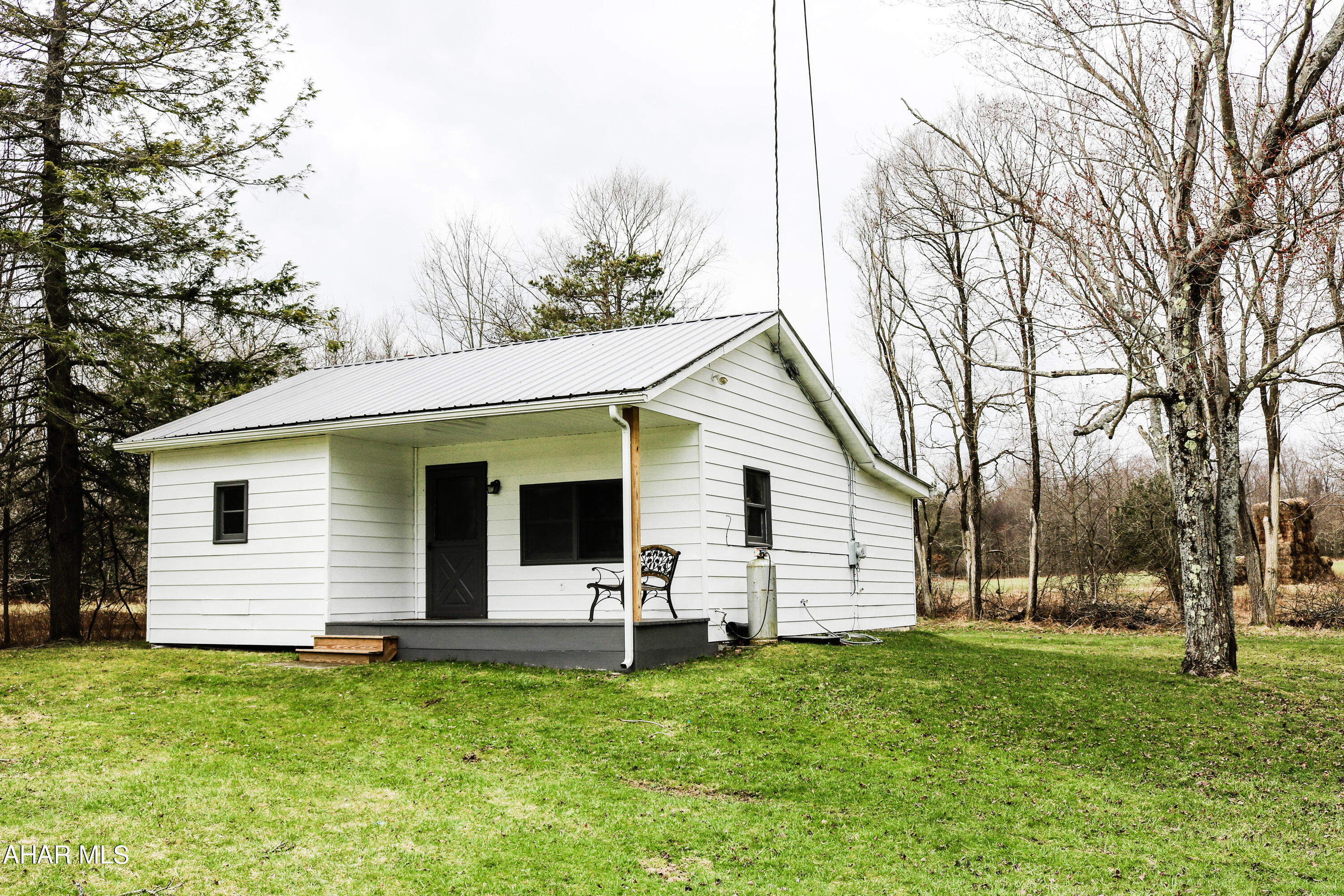 Your house hunting is over! Make this cozy, cabin your full-time residence or getaway! Beautiful  home on 1. 27 acres land. 2 bedrooms and 1 full bath, living room, kitchen, dining room, utility room.  Enjoy the views from all parts of the property.  Lage barn for all your recreation items for all seasons!  Nice back deck to enjoy the outdoors or entertain.  Location Location!!! Close to Mountain Ridge ATV, Indian Lake and Lake Stonycreek. PLUS Property adjoins 600+ acres belonging to New Baltimore Sportsman's Club.  A must see!