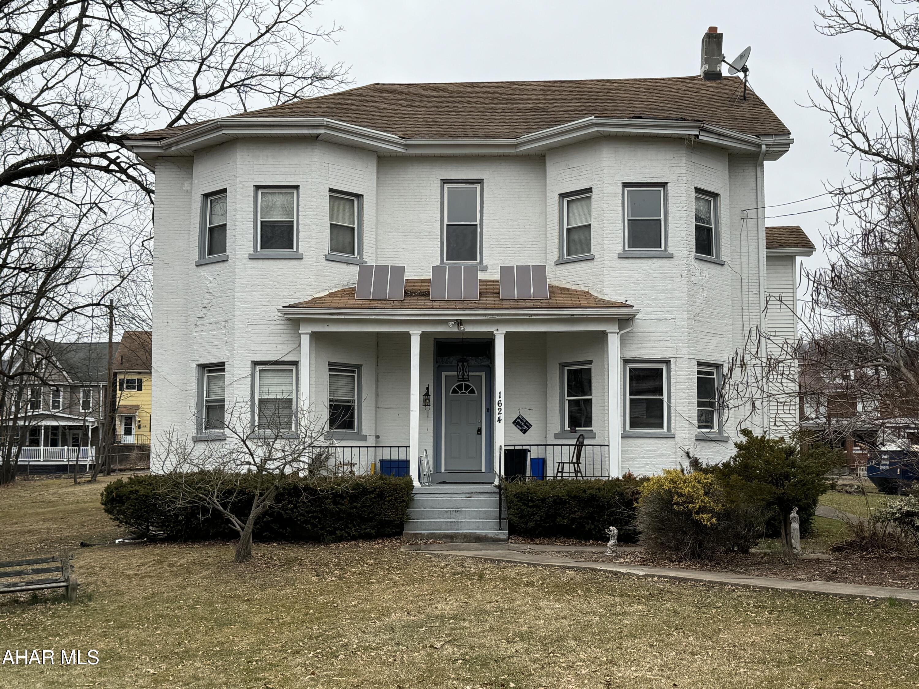 Welcome to this charming brick home built in 1850! This home has endless possibilities. Keep as a family home, live on one side and rent out the other 2 (could be 3 units) or use it for an investment! The .88 acre of ground is fully fenced. There are basically 2 kitchens and baths on the first floor.  There is 1 kitchen and 2 baths on the second. The home has new flooring and new wall units. Definitely lots of space here! Call listing agent to tour!