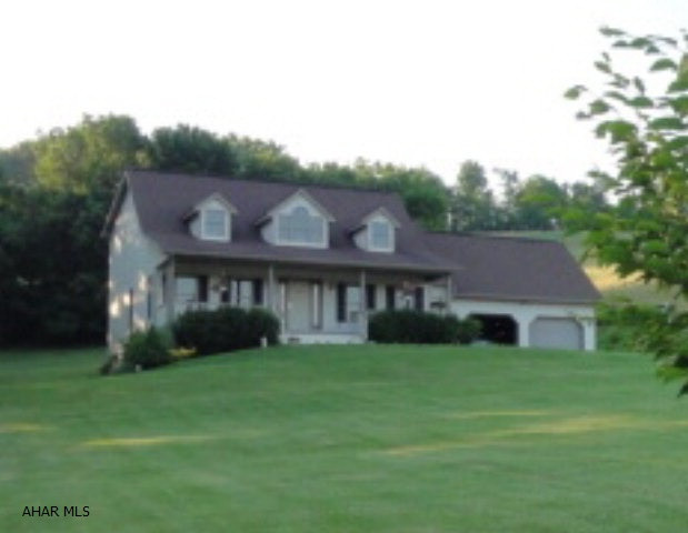 Sitting on almost 2 acres of ground is your well-cared for home, move-in ready and offering spectacular views in a country setting.  This is your opportunity to enjoy a quality built house done with beautiful craftsmanship that is great for guest entertaining.  This house has it all - and is much larger than it looks.  From the moment you enter the doorway the soaring vaulted ceiling opens up this lovely spacious home.  The kitchen area includes a large breakfast/sitting area and overlooks a 28'by 12' deck with hilltop views.  Built in 1999, this house has 2200 square feet and was custom-built with 2x12 floor joists and 2x6 framing.  It includes 3-4 bedrooms, depending on their use, with walk-in closets, 2 1/2 baths, a 1st floor master, lots of storage space, and an attached 2-car garage.
