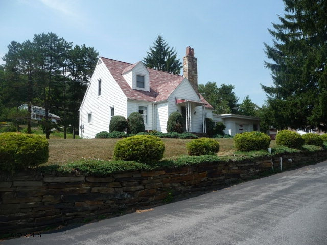 Nice 3BR/3Ba Cape Cod in convenient, close to town location. This home offers a living room with wood fireplace, a basement family room with wood burning stove, office, breezeway, an attached one-car garage and a detached three-car garage with substantial overhead storage. A large paved area for substantial parking is available. HOME Warranty!