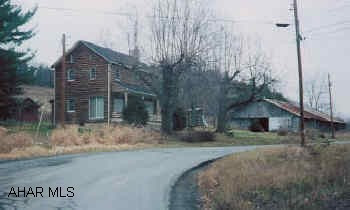 11.8 acre farmette. Five mile from I99. Rustic 2 story house with 3 BR , 2BA. Large barn and out-buildings.
