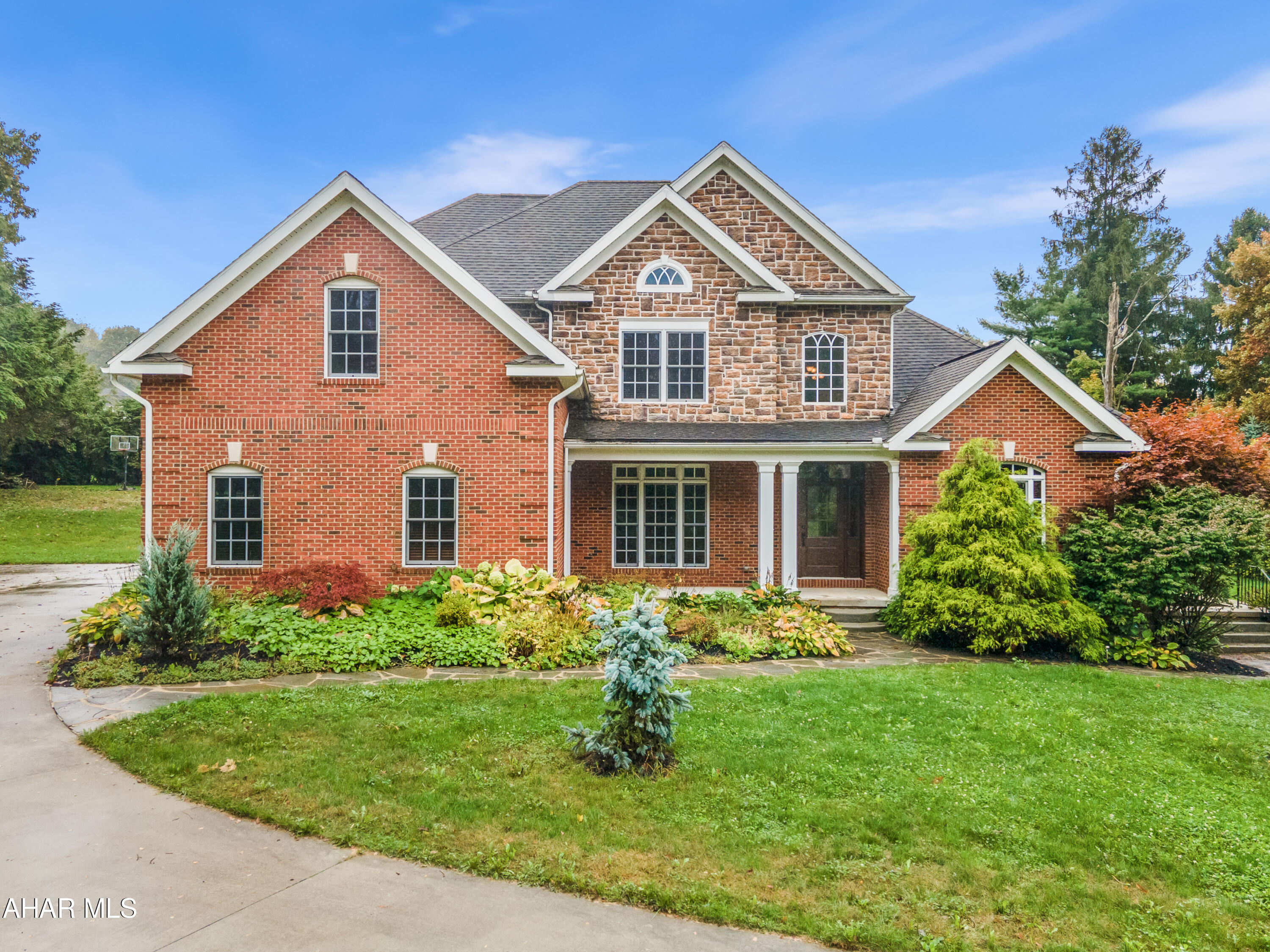 Welcome to 614 Laurel Avenue, a stunning custom-built residence nestled in Cresson Borough within the Penn Cambria School District. This remarkable home showcases unparalleled craftsmanship & luxurious features, designed to fulfill your every dream. As you step inside, you are greeted by a grand foyer that sets the tone for the elegance throughout. The main floor boasts an inviting formal living room, a sophisticated dining room, & a spacious family room adorned with soaring cathedral ceilings. The heart of the home is the fully customized kitchen, perfect for entertaining, complete with high-end granite countertops & abundant space for gatherings. Unwind in the cozy sitting area featuring a gas fireplace, or enjoy the convenience of a first-floor laundry & a well-appointed powder room. Retreat to the magnificent first floor master bedroom, which includes a breathtaking full bathroom & an expansive walk-in closet designed for luxury & organization. Upstairs, you will find three generously sized bedrooms with ample closet space, a convenient Jack & Jill bathroom, an additional full bathroom, & an impressive bonus room that can easily serve as a fifth bedroom. The fully finished basement adds even more living & entertaining space, complete with exterior access, a mechanical room, a full bathroom & additional storage. Outside, the property is equally captivating, featuring a large heated three-car attached garage, a beautiful stone patio, meticulously designed landscaping, a durable concrete driveway, & privacy-enhancing trees. Don't miss the opportunity to experience this one-of-a-kind custom home. Schedule your private tour today! The garage to the rear of the home at 7738 Admiral Peary is also up for sale, possible package deal available.