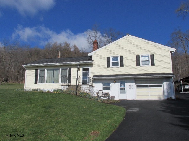 Country living on almost 3 acres, 3 bedroom, 2 bath, split level, all new windows, 200 amp service, newer carpet, hardwood floors under carpet, 2 storage buildings, pavilion, walk-up attic for storage, very private wooded setting. Won't last, schedule your showing today.