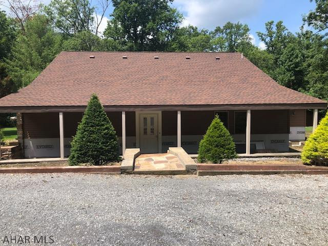 Great opportunity to finish this  home with your own style. Older home that has an addition built on and many updates already completed.  Beautiful stone fireplace in living room, gorgeous ceilings in great room, some building materials stay with property. Property has circular driveway and mature landscaping. Come make this home your dream home.  Listed to sell.