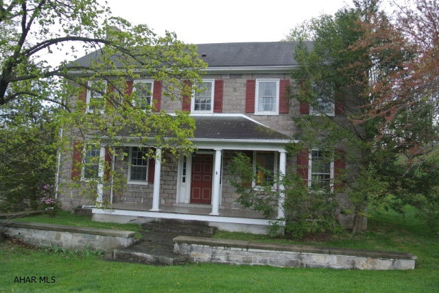 Historic stone home Circa 1820 situated where the Lenape Indian Path crossed into Blair Co. Currently a private residence, originally the basement served as a tavern and dry goods store. The home has the character & charm of yester year, but with updated amenities including skylights, corian countertops in kitchen, Quaker Made cherry cabinets, down-draft cooktop. 5 Stone fireplaces, a few have been blocked with insulation....could be opened. Beautiful wood floors, thick stone window sills. Large lot 1.5 + acres includes dog kennel, shed & 2 car garage.