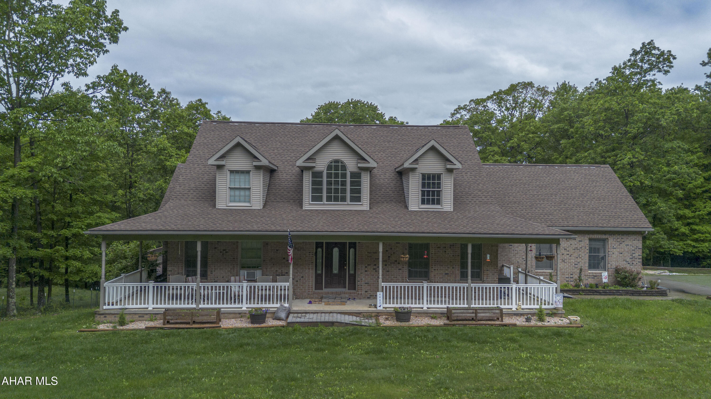 Set on just about 10 picturesque acres, this extraordinary custom home offers the perfect blend of luxury, comfort, and country charm. Designed with impressive cathedral ceilings and expansive windows, the home is filled with natural light and breathtaking views from every angle. A welcoming wraparound porch creates the ideal space for relaxing mornings and peaceful evenings surrounded by nature.

Inside, the spacious layout features 3 beautifully appointed bedrooms and 3 full bathrooms and 1 half bath, including a stunning master retreat complete with a l master suite designed for ultimate comfort and privacy. The heart of the home includes an elegant living room with soaring ceilings, creating a warm yet grand atmosphere perfect for entertaining or everyday living.

The massive finished basement expands the living space even further with three rooms that can serve as guest quarters, recreation areas, a home gym, and an office space. A custom wet bar adds the perfect touch for hosting gatherings and entertaining guests.

Completing the property is an impressive 4-car garage offering ample space for vehicles, storage, and hobbies. Surrounded by open land and scenic beauty, this remarkable estate delivers upscale living with the tranquility of a private countryside retreat.