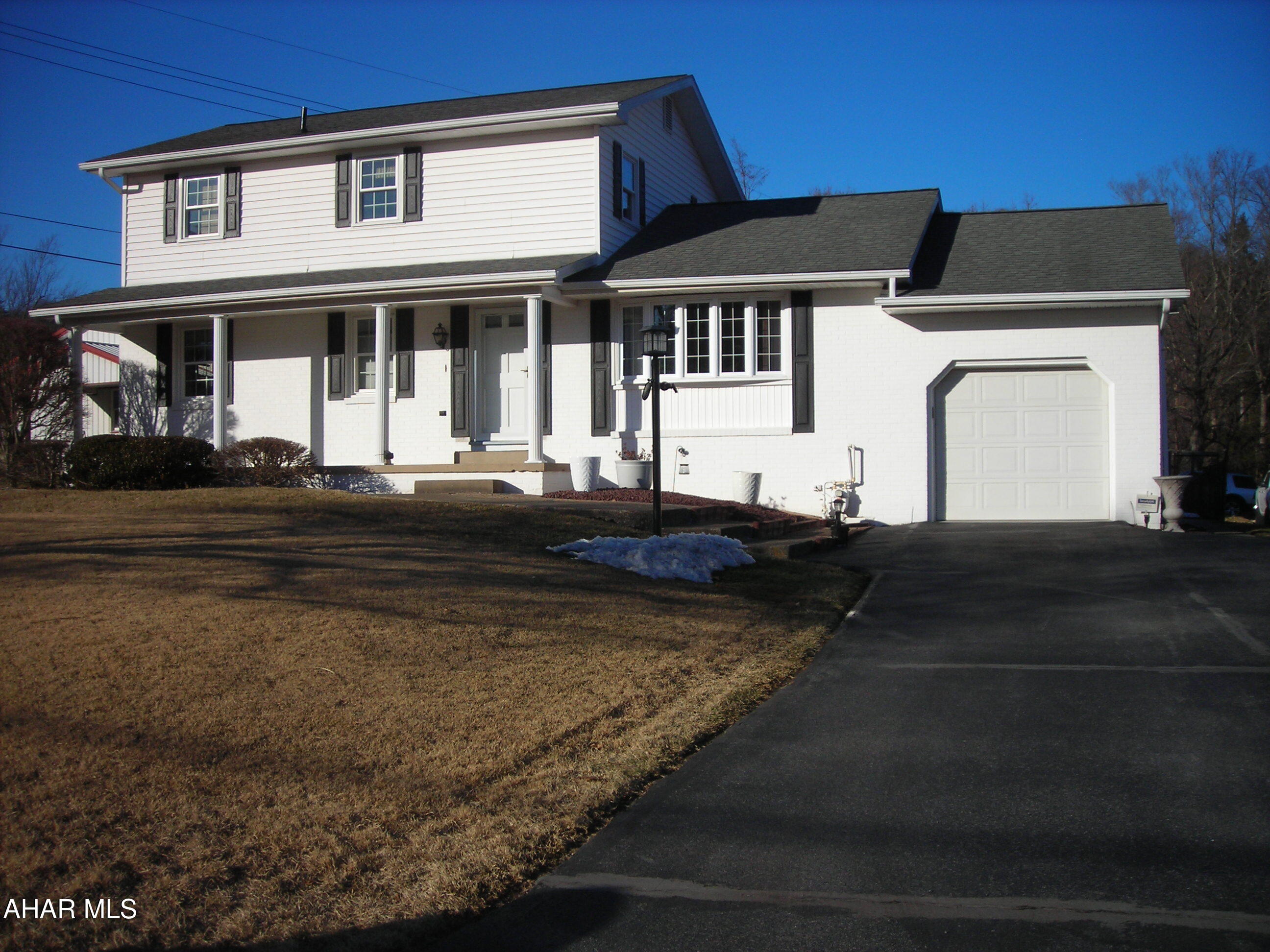 Welcome to 3576 Juniata Gap Road where you will find this stunning well cared for two story home that has only had one owner since built. This home features a covered front porch & rear covered patio/porch measuring 21x21 with built in gas grille and bar sink. If you like more sun there are two lower patios for you to enjoy. There is a partially fenced in area and shed. A driveway for off street parking that can hold 5 cars easily. From there you enter the garage which is fully insulated and drywalled with above storage area extending over the kitchen area. From the garage you can access the main level or go down to the lower level where you will find a finished family room with new carpet, a gas fireplace and a dry bar with stools. Behind that there is a laundry area and bonus area for additional storage. The main level has hardwood floors under all the carpeted areas. There is a full bath, bedroom and bonus room on this level. The dining room off the kitchen offers a mirrored wall that gives you an open feeling and allows you to see into the living room. The second level has a super large Master Bedroom (21x21) with two double door closets and carpet. A large full bath with a nice linen closet. Off the bath there is a dressing room with a sink and cabinets. Also on the level there is another bedroom with two closets. Come take a look - you'll be glad you did!!