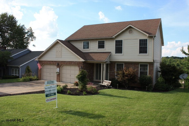 Panoramic view of Hollidaysburg from this beautiful 4 BR, 2 Full BA, 2 Half BA home in the Brentwood Subdivision of Penn Farm Estates.  Kitchen has bay window and beautiful Solid Surface Counters with Italian Tumbled Marble Backsplash.  Oak Hardwood floors in entry, DR, LR.  New carpeting throughout.  Formal LR with bay window.  Large Formal DR.  Vaulted Ceiling in FR with Half BA.  Large Master Suite with walk-in closet and access to additional storage area.  BR #2 is large.  3-zone gas hot water heat.  2-zone A/C with cooling on all 3 levels.  Gorgeous hardscape patio and waterscape.  Incredible and easy maintenance landscaping.  Covered deck with vaulted ceiling, skylights, and overhead fan. Much backyard privacy.  Exceptional fully finished walk-out basement with fireplace