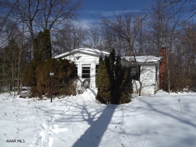 Breezewood Acre lot with double wide home on full foundation and retired title. No disclosures.