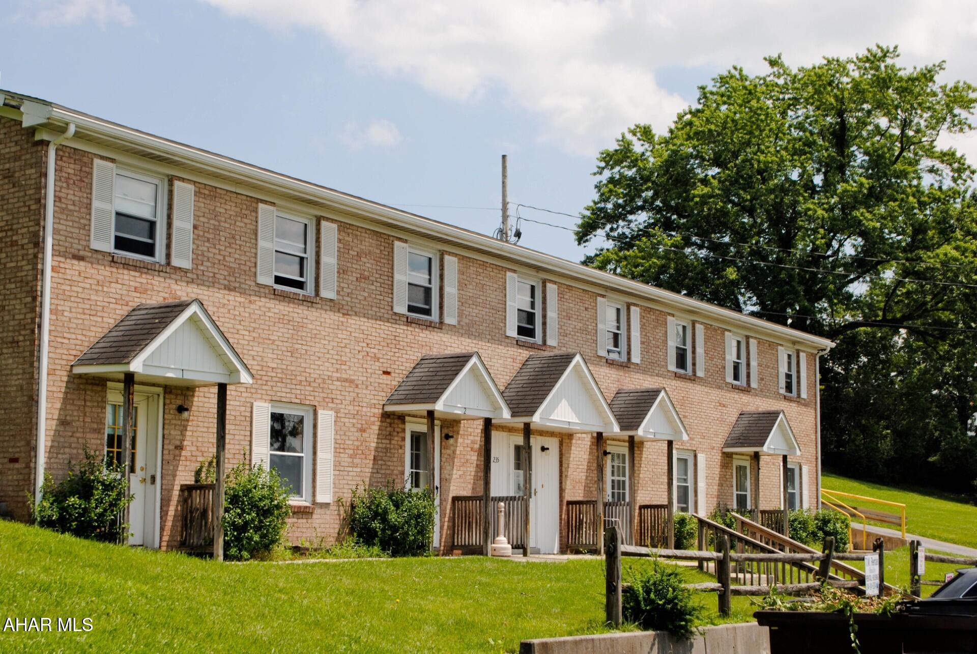 Exceptional investment opportunity featuring two multi-unit buildings sold together at 224 St. Mary Street and 235 St. Joseph Street in Loretto, PA. The portfolio offers a total of 10 residential units, with five units in each building, conveniently located on the Saint Francis University campus. St, Mary building is configured with two bedrooms, one-and-one-half bathrooms, a kitchen, and a living room, providing an attractive layout for student, faculty, workforce, or traditional residential housing. St. Joseph building is configured with one three bedroom 11.5 bath,, and four 2 bedroom, 1.5 baths, large living room, and kitchen. The St. Joseph Street building contains approximately 5,712 square feet, while the St. Mary Street building contains approximately 4,590 square feet, for a combined total of approximately 10,302 square feet. Buildings feature brick, block, and vinyl construction, shingle roofs, electric baseboard heat, public water, public sewer, and 200-amp electrical service with breakers. Each property provides blacktop parking with space for approximately seven to nine vehicles per building. The St. Joseph Street property also includes a separate utility room for the hot-water tank and space that is used as an office or paid-to-use laundry area. Appliances and certain furnishings located within the units are included with the sale, subject to the terms of the agreement. Tenant-owned personal property is excluded. This offering provides an excellent opportunity for an investor seeking a sizable residential portfolio in a desirable Loretto location. With 10 total units, established rental potential, off-street parking, and proximity to Saint Francis University and community amenities, these properties offer multiple possibilities for continued operation, repositioning, or future income growth. Properties are being sold together as one investment package. Financial information, occupancy details, leases, and additional documentation are available to qualified buyers upon request. Schedule your private tour today10302