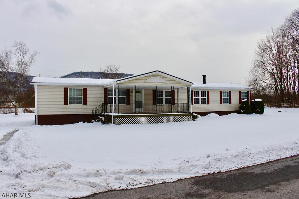 Great opportunity to purchase two homes for one great price!  Whether you want to use both homes as investment properties or live in one home and rent the other home out.  324 Spruce St is a 1996 3 bedroom 2 full bath Champion doublewide and 330 Spruce St is a 1982 2 bedroom 2 full bath Windsor.  The large (approx half acre) lot has an open yard with plenty of space between the homes.