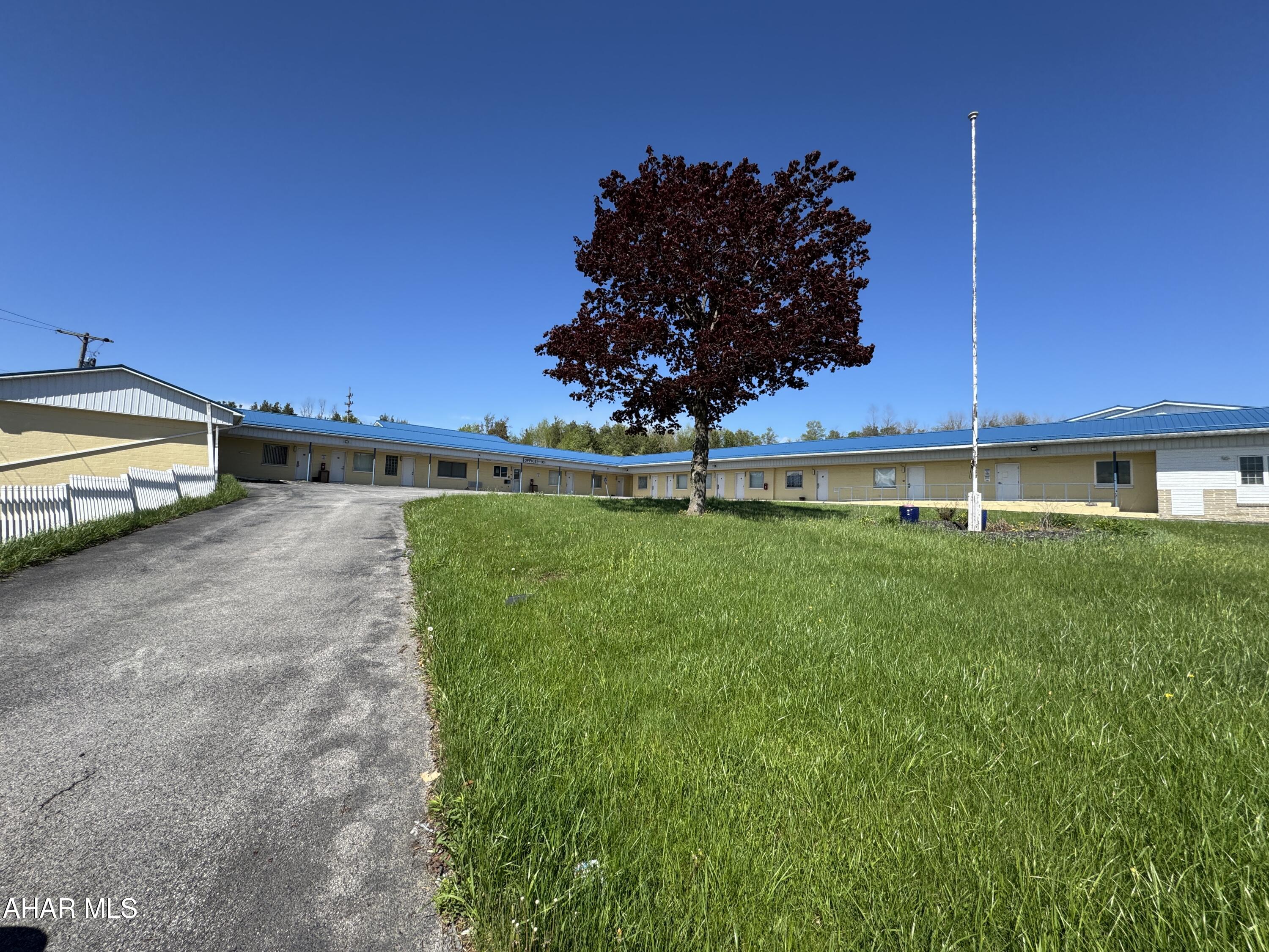 Prime commercial location!  5.7 Acres on Rowena Drive with improvements consisting of a 25 unit motel, restaurant. This will make a great development site with on and off access to US Route 22.  Owners may be willing to raise the motel if needed. High visibility location with great frontage and traffic count. Best use may be for other commercial business. Site is slight sloping and has public water, sewer, gas and electric. Commanding location for this growing county seat.