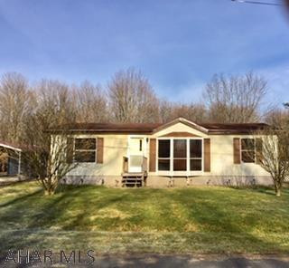 Well-maintained manufactured home on 0.27 acres. One owner. Carport and shed. All new carpet and newly painted cabinets. Nice, flat lot that is full of potential.