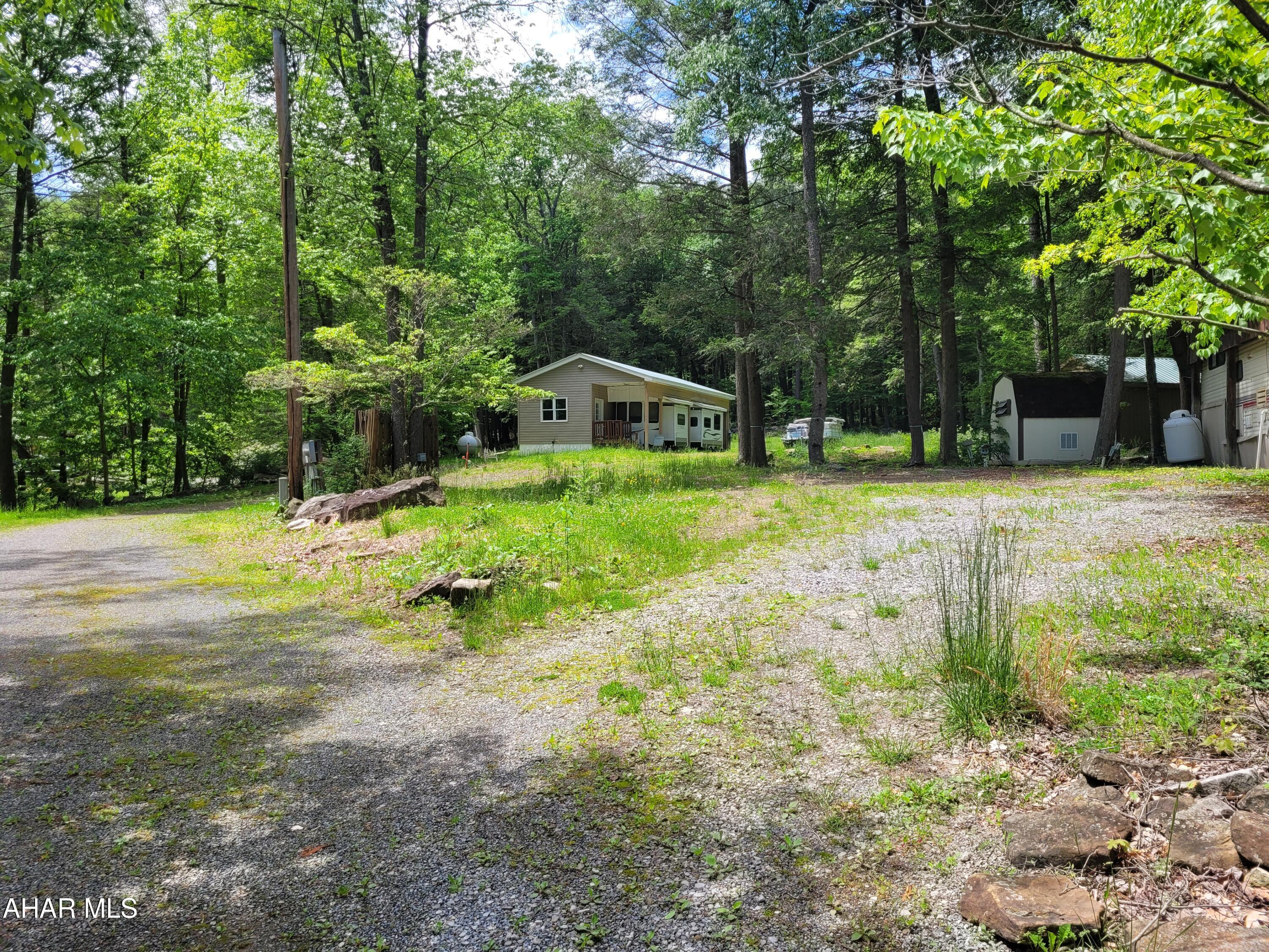 Permanent campsite in Glendale Yearound.  Public water / sewer and electricity are on the lot.