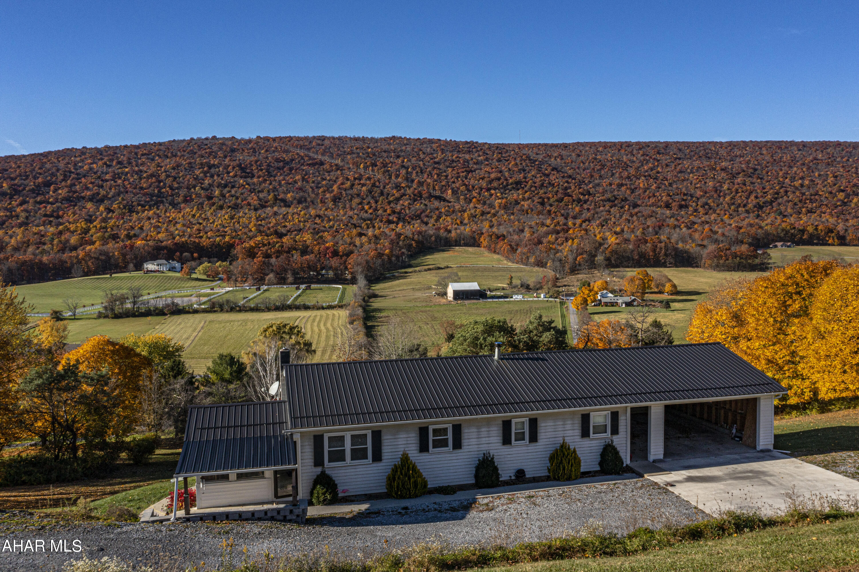 Come take a look at this beautiful 4 bedroom 2 bath home sitting on 1 acre in Scotch Valley.  Be immediately drawn in by the spectacular mountain views from the living room window. The eat in kitchen features a large pantry and Corian countertops.  The primary bedroom has en suite facilities. The lower level makes for great entertaining as it consists of a big family room with a bar area and wood burner. Large workshop located on the lower level walks right out to side yard and shed.