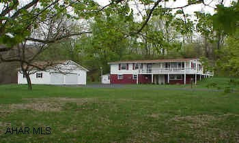 Village of Henrietta.  Modular on full finished foundation.  Very pretty setting with large pond.  Newer windows, roof, & furnace.  Recent survey copies available.