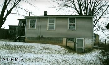Bungalow with 1 bedroom and half bath, newer siding and asphalt shingle roof. Close to shopping.