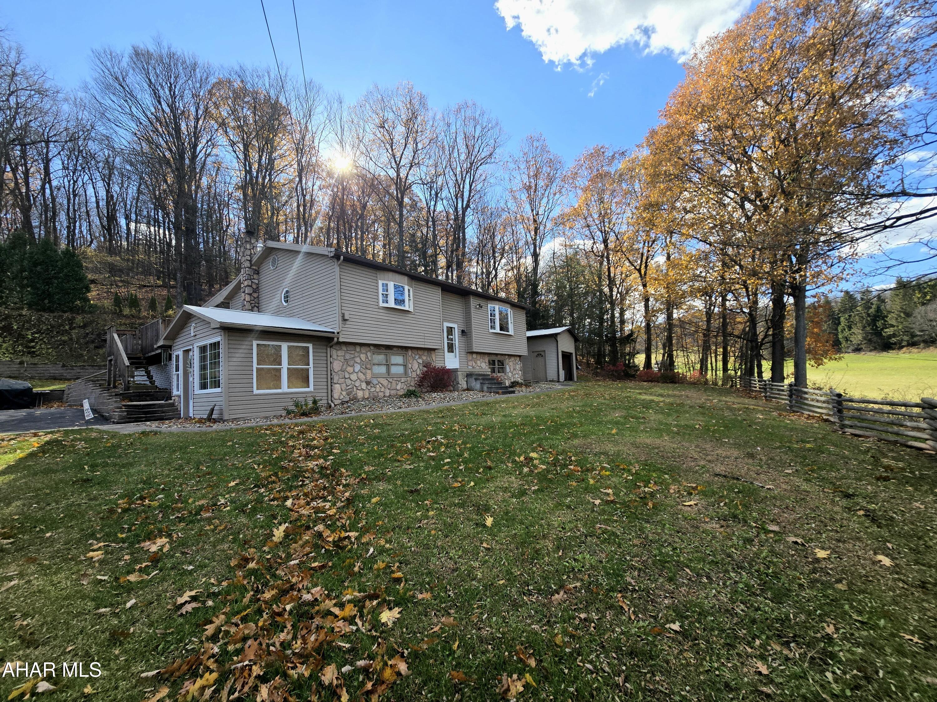 New Listing in Puzzletown Area!  Situated on over 2 picturesque acres this 3 bedroom 2 full bathroom home also features: 4 car detached garages, a second structure that has endless potential (accessory unit for additional living, rental income, business, or man cave to name a few).  Walk in the front door and be amazed by the condition and updates throughout.  The main level features an open floor plan with 2 large bedrooms and full bath.  The rear sunroom is perfect for enjoying evenings or entertaining.  The lower level offers an additional family room with canning kitchen, full bath, bedroom, and breezeway.  Something like this is a rare find and will not last!