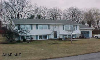Immaculate condition, newer roof and windows, heat is electric storage-$1200/yr., Gazebo, shed, hardwood florrs, well on property, sunroom, office, and pergo in lower level