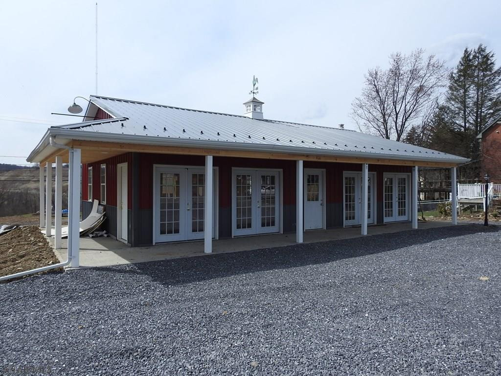New building built in 2017.  Great location along Logan Blvd close to Convention Center and new UPMC Logan Medical Center. Front and rear access, also includes a garage in the back for storage or workshop. Property sold as-is, buyer responsible for improvements necessary to make it code compliant based on use. TAXES LISTED ARE FOR LOT ONLY - PROPERTY HAS NOT BEEN REASSESSED BY THE COUNTY!