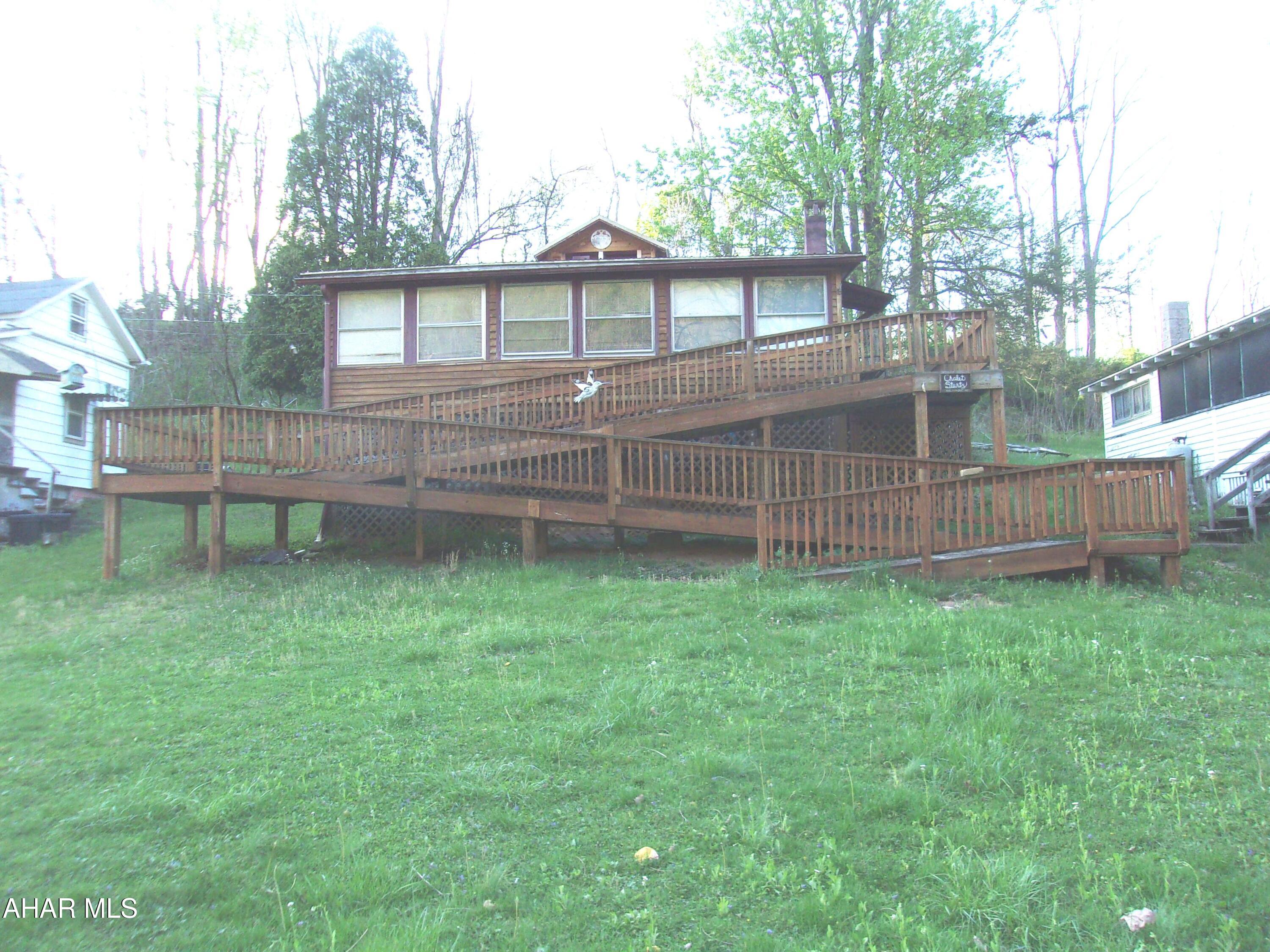 Come to the river!  Enjoy your morning coffee on the screened-in porch, overlooking the river. Walk out your front door, down to the water to fish and swim. Canoe or boat or just drift along in the Juniata River that winds its way through this beach community. 
Grill outdoors and relax around the firepit as the day comes to an end.
The 2 bedroom cabin sleeps 5+ (living room has a pull out couch) but with a few changes, could easily sleep 8.
Two screened-in porches and eat-in kitchen, Everything is included!! Furniture, kitchen cookware, dishes and utensils.  Even a canoe and boat! What could be easier?  Come and see!  It's summer! Time to have fun!