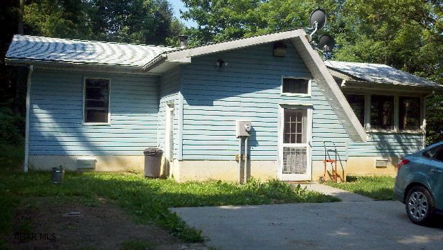 Country Cutie  -  cozy 2 bedroom, 1 story in move in condition, on 7 acres of wooded land that joins the State Game Lands.