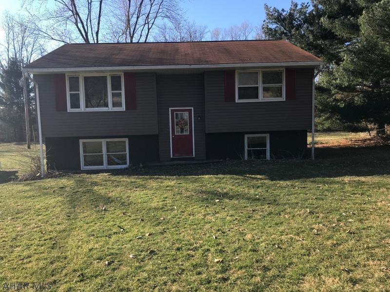 70's bi-level, 2 bedroom, 1 full bath in need of TLC. Enjoy the treed lot and stream. Sale AS-IS.