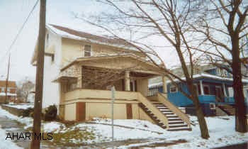 Large 2 story on corner.  Good mechanics.  3/4 bath in basement.  Original Woodwork.