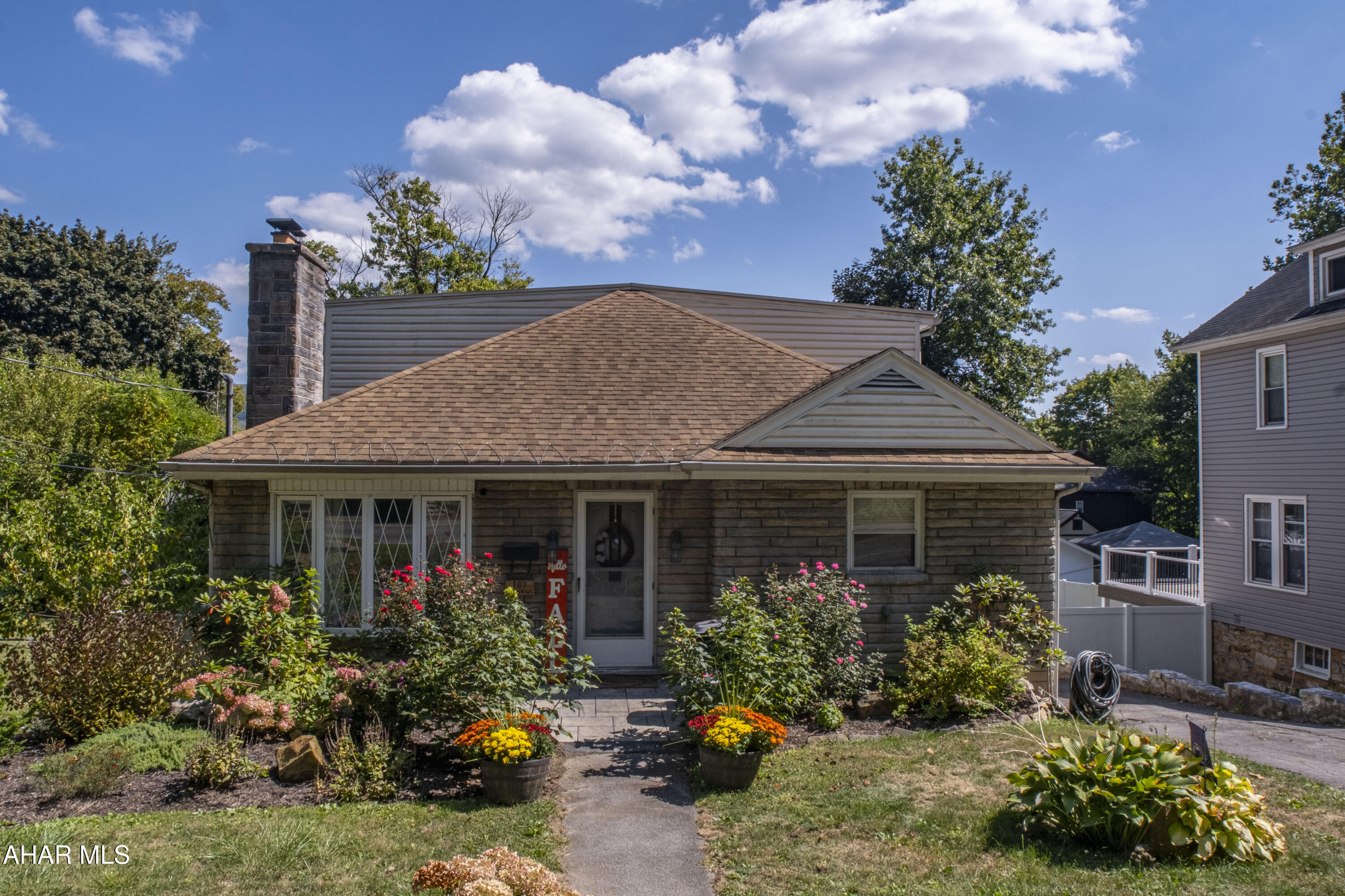 Welcome to the most charming stone home on Ruskin Drive in the Llyswen Neighborhood. This home features 4 bedrooms and 2 full baths. Three bedrooms, full bath, kitchen, living room on one level. Then make your way upstairs to the most spacious and private master ensuite-4th bedroom! The hardwood floors, fire place and central air are just some of the amenities this property has to offer. The 3-car integral garage provides plenty of space for vehicles and storage. Step outside to the large deck with a view over the beautiful yard complete with updated landscape, hardscape and pergola-ideal for relaxation and entertaining! Near Baker Elementary School, you will find shopping, restaurants and more just a short distance away. Don't miss you chance to own this gem! Matterport virtual tour available. Call to schedule your showing today!