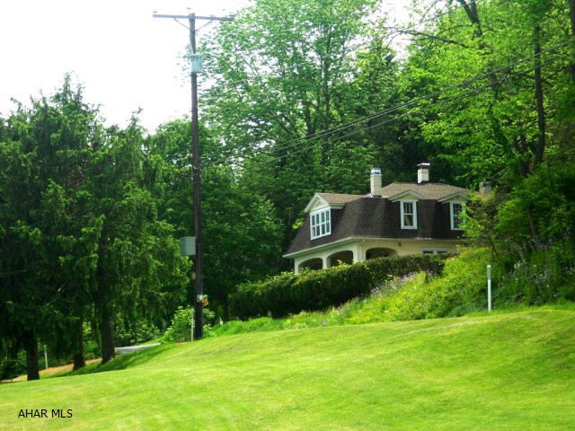 Bungalow style home overlooking the Bedford Elks Country Club. Take in the views of the golf course while sitting the hot tub that sits on the wrap around front deck. Almost 5 acres included for back yard privacy. This house has been priced to sell!