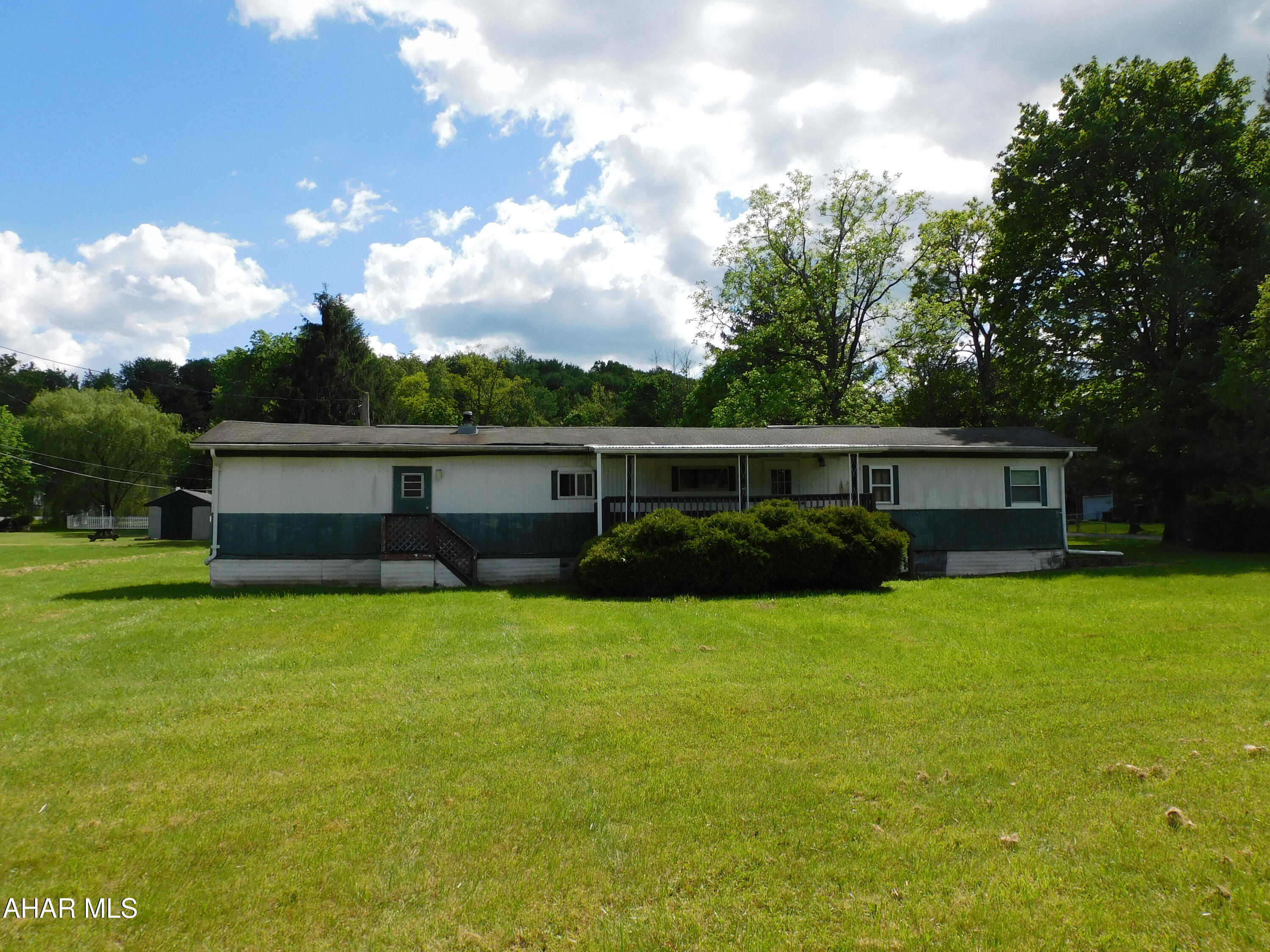 Mobile home in Antis Township/Bellwood Antis School District. 3 bedrooms and 2 bathrooms. 2 car garage and shed. Sits on a flat 200 x 120 lot.  Tenant pay $500 per month. Tenant pays $40  per month towards water and sewer. Tenant pays electric, oil. trash, and snow removal. Landlord pays for lawncare.
