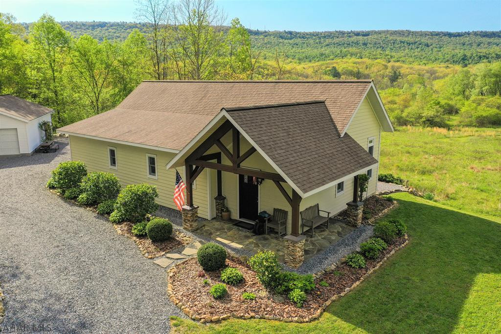 QUALITY, 1 of a kind, custom built timber frame home!! True GREEN home offering R-58 & R-40 insulated walls, timber frame construction w/ local wood and SIP insulation, geothermal electric heat pump w/ A/C, architect designed passive solar heat, & southern exposure. Open concept w/ 16' cathedral ceilings, Schlulter Ditra & porcelain tile floors, & frosted glass pockets doors. GR w/ FP & beautiful mountain views, custom kit cabinets w/ Cambria Quartz counters & Delta touch faucet, dining area, 2- beds including a master w/ ensuite bath w/ double Italian marble sink, tiled steam room/shower w/ glass door & speakers, & another full bath w/ tile, & storage/utility rm. Separate office building w/ bath, craft rm, & entertainment rm. 2-car garage w/ lg. workshop. No expense spared in this build!!